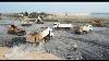 A Lot Of Heavy Machinery Powerful Wheels Loader Sdlg And Sacman Loading Trucks Transporting Rocks
